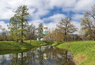 Landscape with a pond and the church