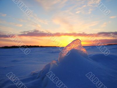 Winter frosen sea sunset and gold ice in Finland