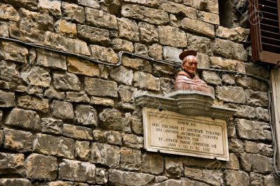 Sculpture Domum on a building wall near cathedral Duomo. Florenc