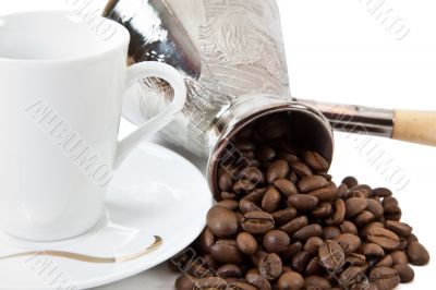 Coffee grains in a white cup