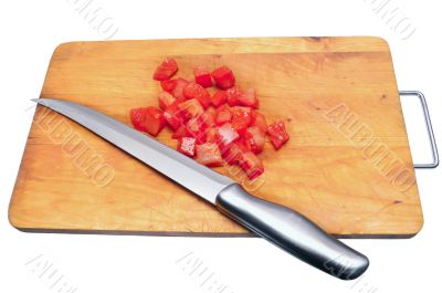 slices of tomatoes and a knife on a chopping board
