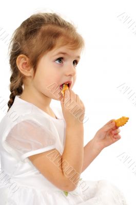 The girl eats cookies