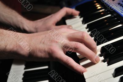 Man playing synthesizer