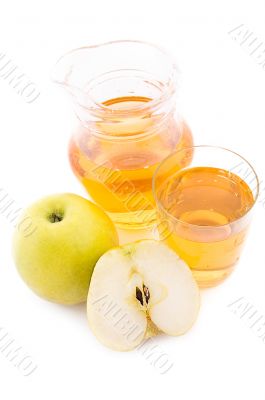 Jug and glass of apple juice
