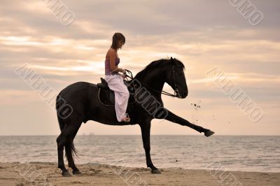 girl and  horse on the beach