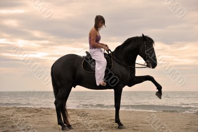 girl and  horse on the beach