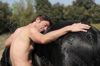 naked man and stallion