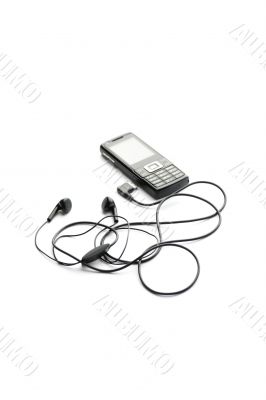 Black mobile phone isolated on white closeup