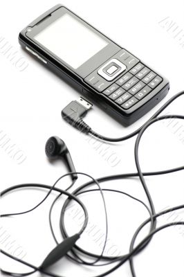Black mobile phone isolated on white close up