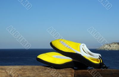 Beachshoes Against the Sea Background