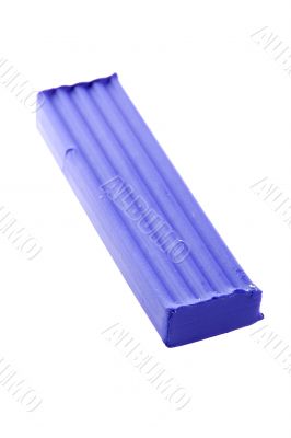 Blue plasticine on white macro