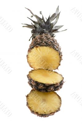 Cutting pineapple on white