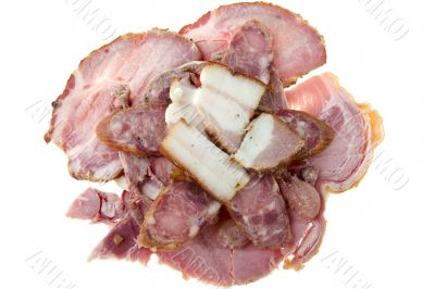 Cutting smoked sausage and pork gammon 