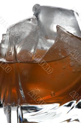 glass of whiskey on white macro