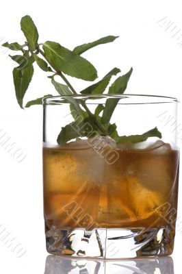 glass of whiskey with mint
