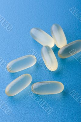 group pill on blue macro
