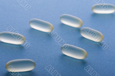 Medical pill on blue