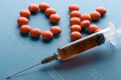 Medical Tablet and syringe close up