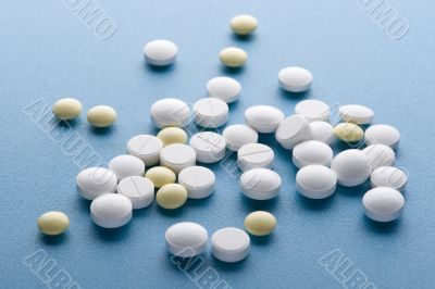 Medical tablet on blue