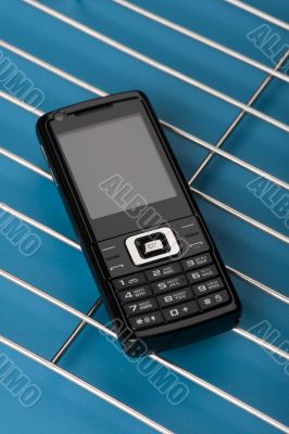 mobile phone on blue close up