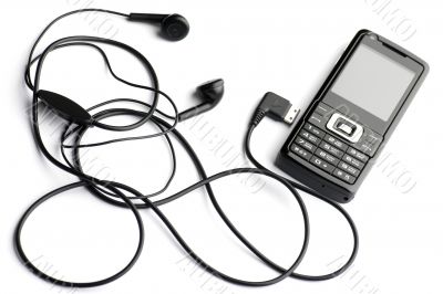 mobile phone with head set on white