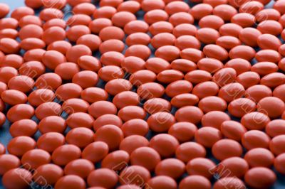 Red Tablet on blue closeup