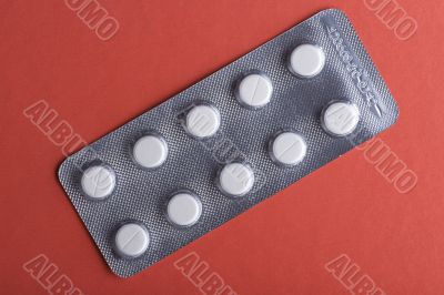 Tablet on red closeup