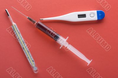 thermometer and syringe