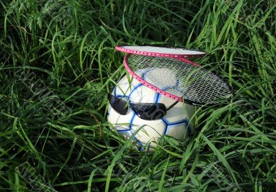 Two Badminton Rackets and Soccer Ball