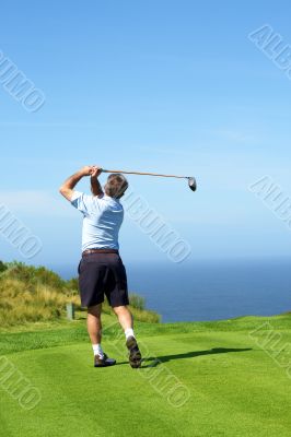 Senior golfer playing golf