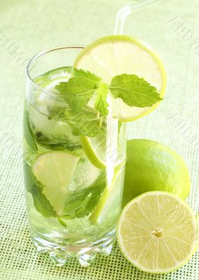 Mojito cocktail on green background