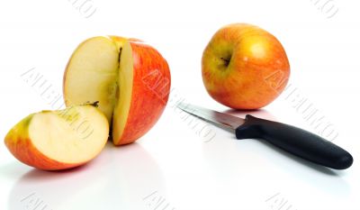 Fresh apples and a knife.
