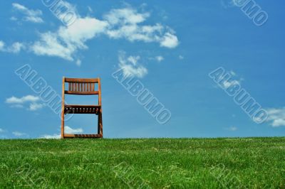 Wooden chair on a hilltop