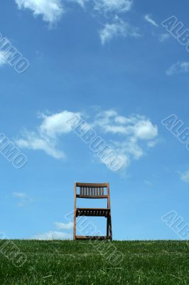 Wooden chair on a hilltop
