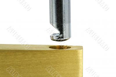 Isolated Brass open lock on white macro