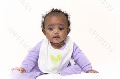 Baby girl learning to sit