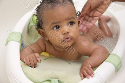 Baby girl taking a bath