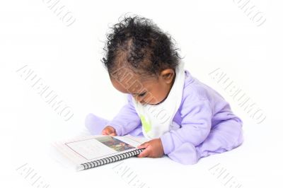 Baby reading a book