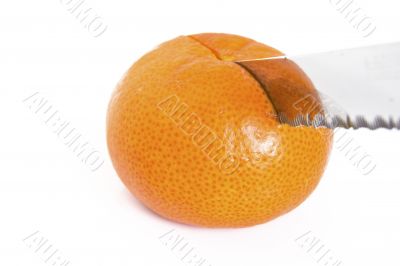 Mandarin orange cut with a knife