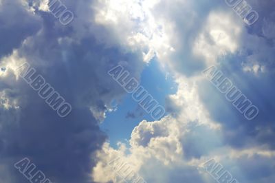 blue sky framed by clouds