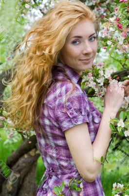 Red-headed womn under cherry tree