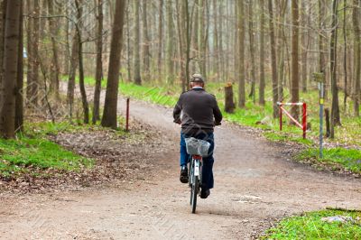 Old man riding a bicycle