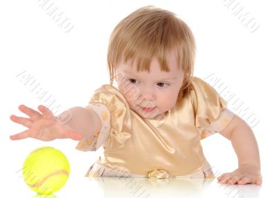 Little girl and tennis ball.