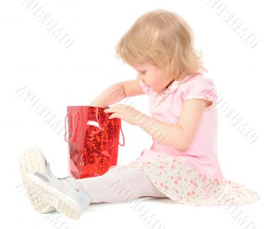 Little girl looking in gift bag