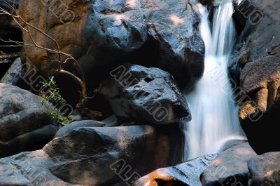 Waterfall In The Rocks