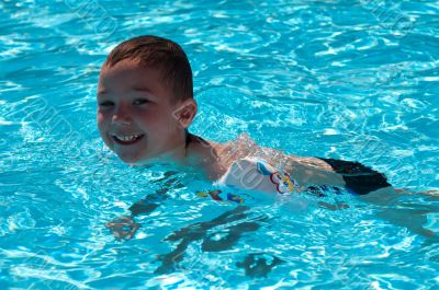 boy swimming in the pool