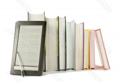 Row of printed books with electronic book reader
