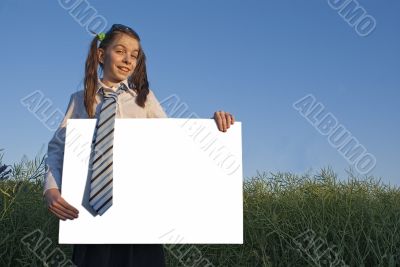 Teen girl holding white poster
