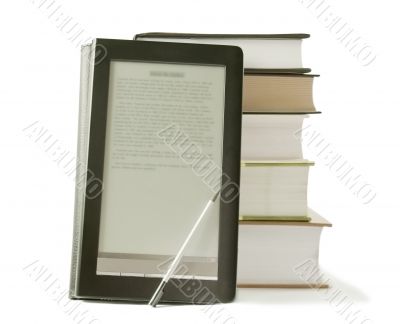 Stack of books and electronic book reader