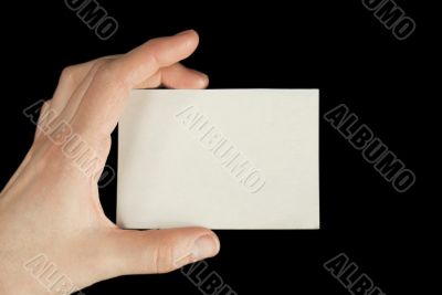 Hand holding a white card